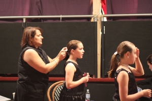 You always need moms backstage to help with hair and makeup.